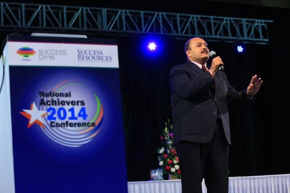 Suren speaking at the National Achievers Conference in 2014