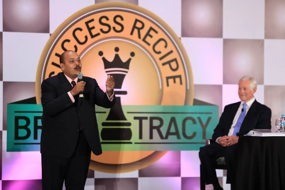 Suren speaking alongside Brian Tracy at the Success Recipe event